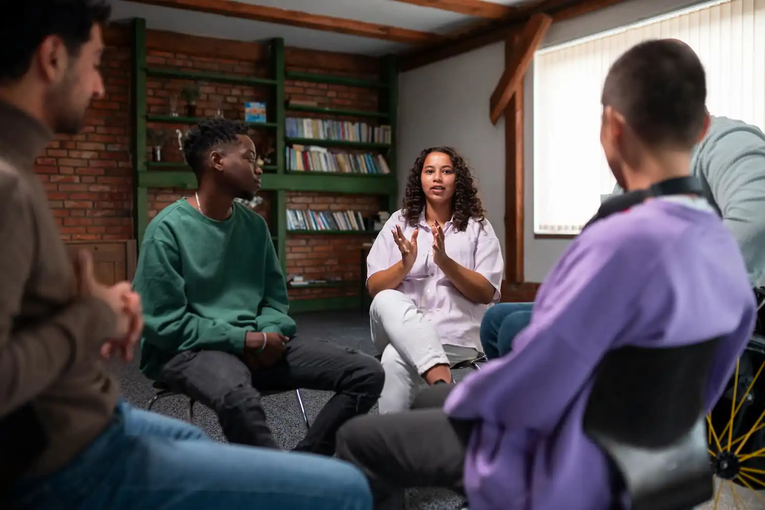 Group therapy session for addiction treatment and mental health support